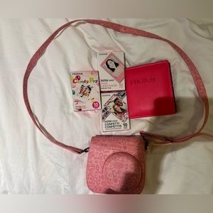 Instax mini camera 11 + case in pink, mini photo album, and three packs of film